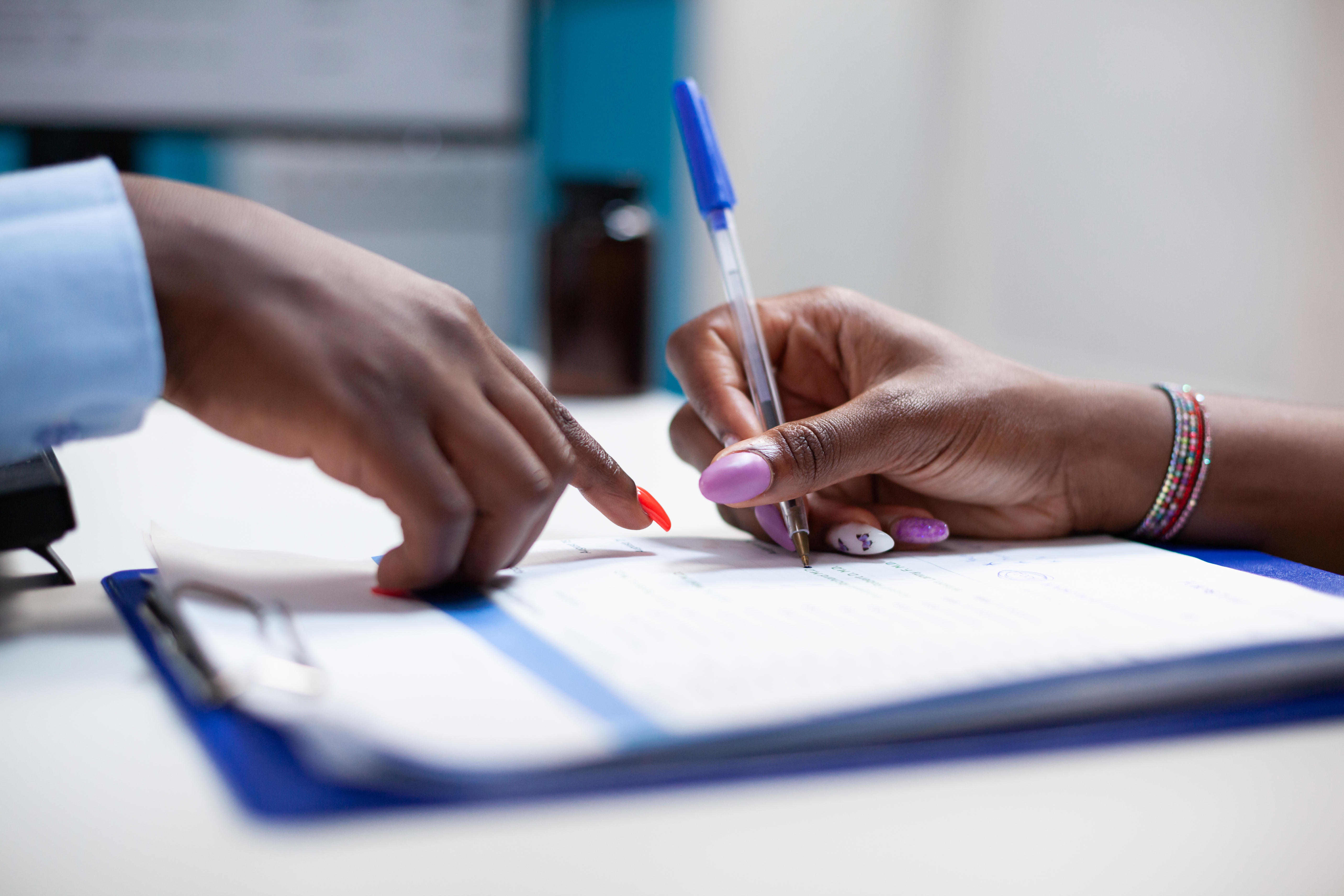 Small business owner reviewing grant paperwork at a desk