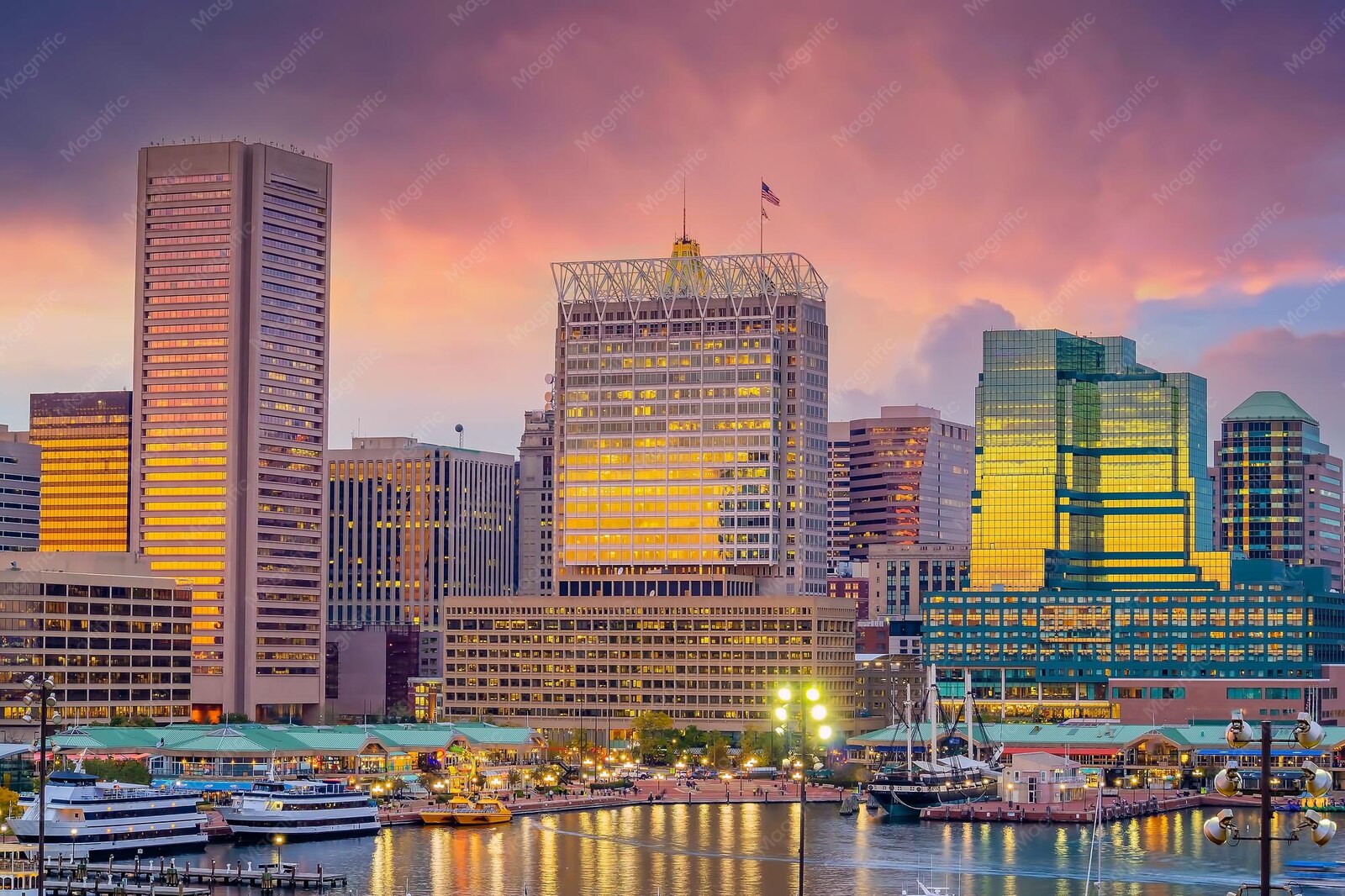 Downtown Baltimore skyline glowing at twilight