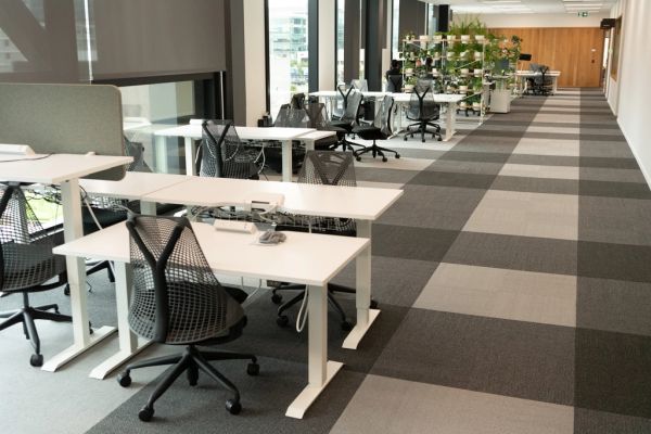 Open coworking space with shared desks and natural light
